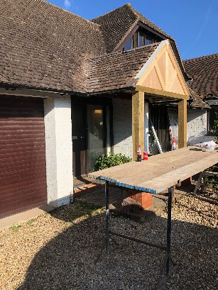 Renovation of a house exterior with a wooden frame.