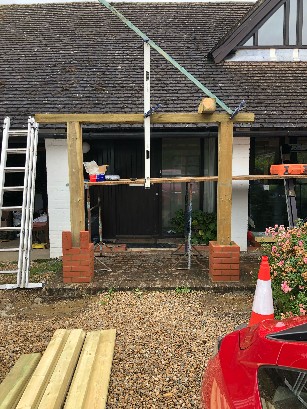 Construction for front of house for a new gable with wooden beams.